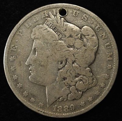 1889-O MORGAN DOLLAR HOLE. TOP RATED AUCTION HOUSE