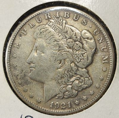 1921-S MORGAN DOLLAR. CHECK OUT OUR UPCOMING AUCTIONS ESTIMATE $90 - $130.