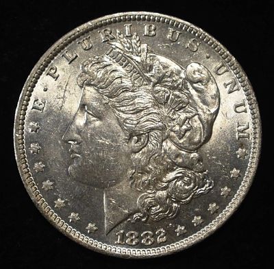 1882-O MORGAN DOLLAR CH BU. BID WITH SILVER CITY AUCTIONS ESTIMATE $450 - $550.