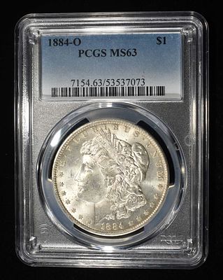 1884-O MORGAN DOLLAR PCGS MS-63. BID WITH SILVER CITY AUCTIONS ESTIMATE $130 - $150.