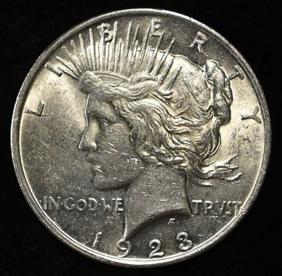 1923 PEACE DOLLAR. TOP RATED AUCTION HOUSE ESTIMATE $90 - $130.