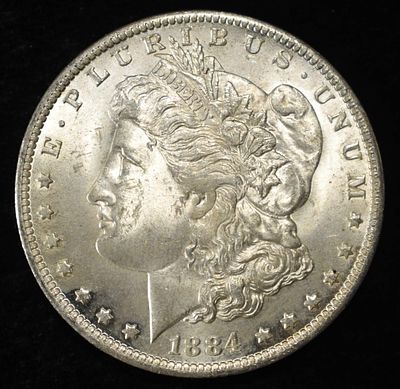 1884-O MORGAN DOLLAR BU. WEEKLY COIN & CURRENCY AUCTIONS ESTIMATE $130 - $150.