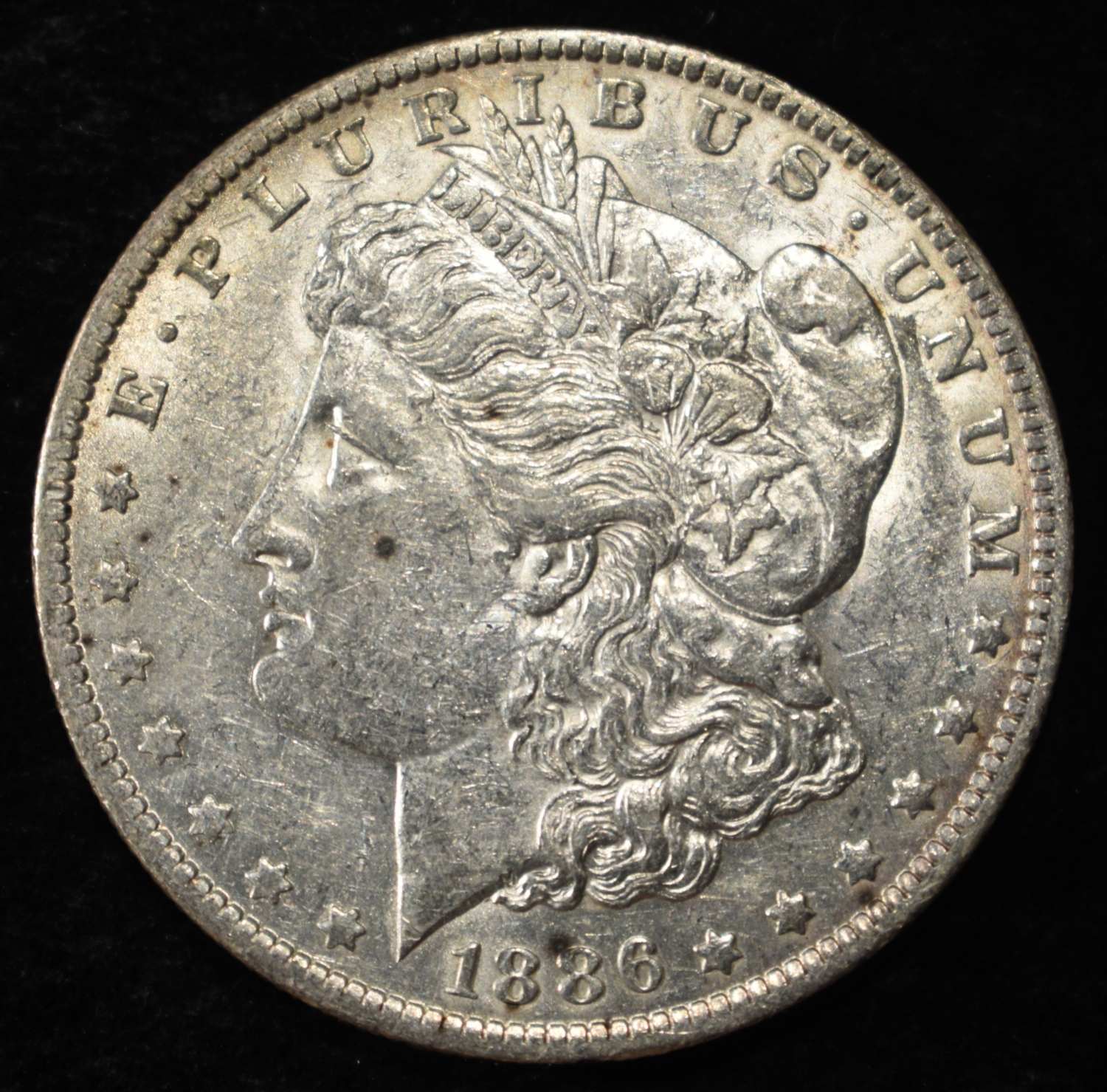 1886-O MORGAN DOLLAR AU