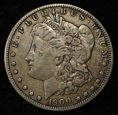 1900-O MORGAN DOLLAR. CHECK OUT OUR UPCOMING AUCTIONS ESTIMATE $90 - $130.