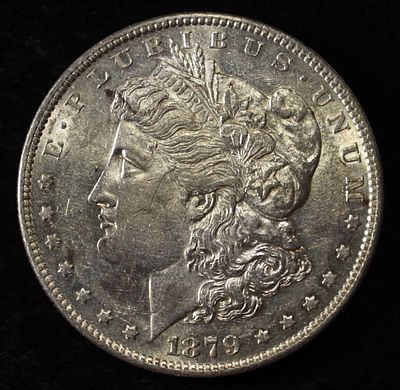 1879-O MORGAN DOLLAR AU/BU. TOP RATED AUCTION HOUSE ESTIMATE $130 - $150.