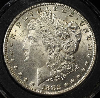 1882 MORGAN DOLLAR CH/GEM BU. CHECK OUT OUR UPCOMING AUCTIONS ESTIMATE $150 - $200.