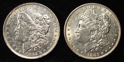 1882-O & 1883-O MORGAN DOLLARS AU. BID WITH SILVER CITY AUCTIONS ESTIMATE $150 - $200.