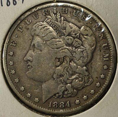 1884 MORGAN DOLLAR. WEEKLY COIN & CURRENCY AUCTIONS ESTIMATE $90 - $130.
