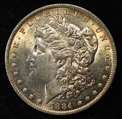 1884-O MORGAN DOLLAR BU. LEADERS IN ON-LINE AUCTIONS ESTIMATE $100 - $130.