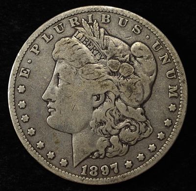1897-O MORGAN DOLLAR. LEADERS IN ON-LINE AUCTIONS ESTIMATE $90 - $130.