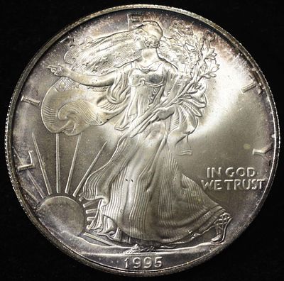 1995 AMERICAN SILVER EAGLE. BID WITH SILVER CITY AUCTIONS ESTIMATE $110 - $160.