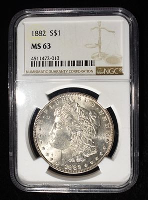1882 MORGAN DOLLAR NGC MS-63. LEADERS IN ON-LINE AUCTIONS ESTIMATE $130 - $150.