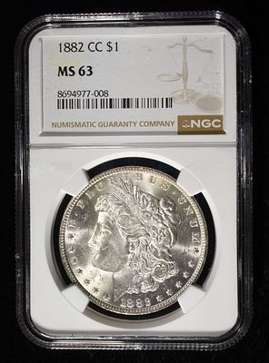 1882-CC MORGAN DOLLAR NGC MS63. CHECK OUT OUR UPCOMING AUCTIONS ESTIMATE $390 - $440.