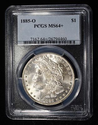 1885-O MORGAN DOLLAR PCGS MS-64+. CHECK OUT OUR UPCOMING AUCTIONS ESTIMATE $180 - $220.