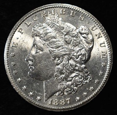 1887-S MORGAN DOLLAR AU. TOP RATED AUCTION HOUSE ESTIMATE $100 - $150.