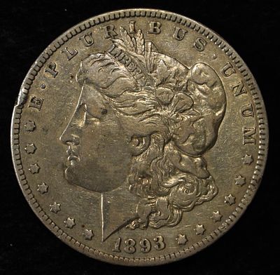 1893-O MORGAN DOLLAR VF/XF. BID WITH SILVER CITY AUCTIONS ESTIMATE $700 - $800.