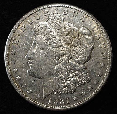 1921-S MORGAN DOLLAR. CHECK OUT OUR UPCOMING AUCTIONS ESTIMATE $140 - $190.
