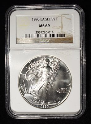 1990 AMERICAN SILVER EAGLE NGC MS69. BID WITH SILVER CITY AUCTIONS ESTIMATE $130 - $180.