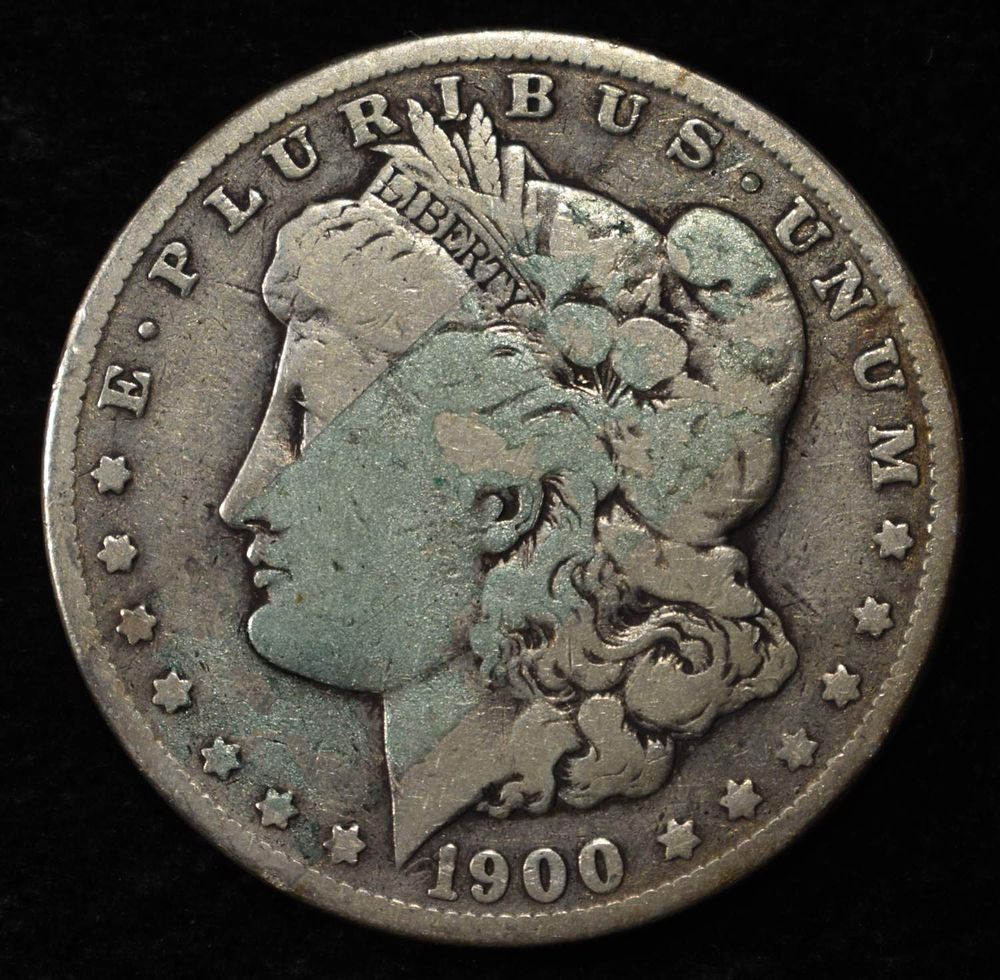 1900-O MORGAN DOLLAR. BID WITH SILVER CITY AUCTIONS ESTIMATE $90 - $130.