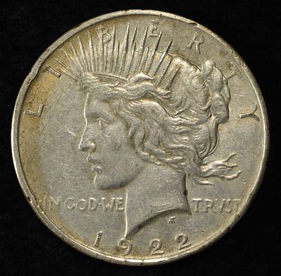 1922 PEACE DOLLAR. CHECK OUT OUR UPCOMING AUCTIONS ESTIMATE $90 - $130.