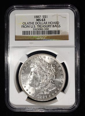 1887 MORGAN DOLLAR NGS MS-63 OLATHE HOARD. BID WITH SILVER CITY AUCTIONS ESTIMATE $130 - $150.