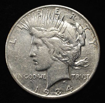 1934-S PEACE DOLLAR XF. WEEKLY COIN & CURRENCY AUCTIONS ESTIMATE $200 - $300.