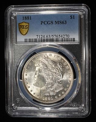1881 MORGAN DOLLAR PCGS MS-63. BID WITH SILVER CITY AUCTIONS ESTIMATE $150 - $200.