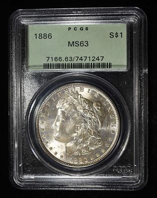 1886 MORGAN DOLLAR PCGS MS-63 OLD GREEN HOLDER. BID WITH SILVER CITY AUCTIONS ESTIMATE $130 - $150.