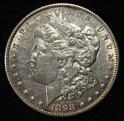 1898 MORGAN DOLLAR AU/BU. TOP RATED AUCTION HOUSE ESTIMATE $80 - $120.