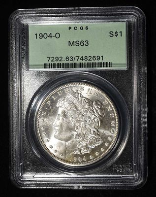 1904-O MORGAN DOLLAR PCGS MS-63 OLD GREEN HOLDER. CHECK OUT OUR UPCOMING AUCTIONS ESTIMATE $130 