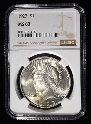 1923 PEACE DOLLAR NGC MS63. TOP RATED AUCTION HOUSE ESTIMATE $120 - $160.