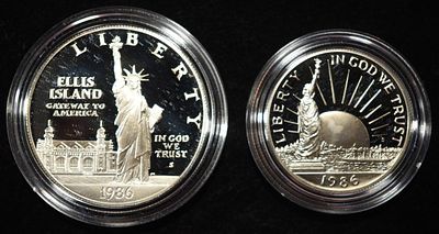 1986-S 50C & $1 COMMEM SET STATUE OF LIBERTY. WEEKLY COIN & CURRENCY AUCTIONS ESTIMATE $110 - $160.