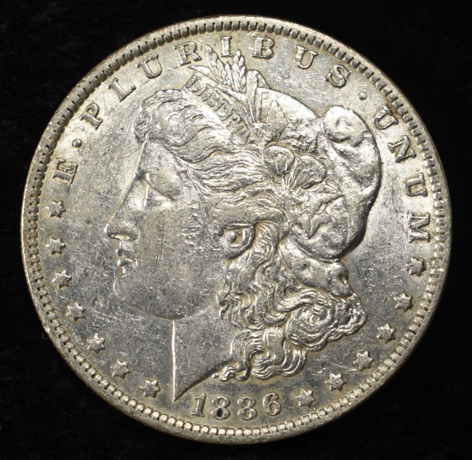 1886-O MORGAN DOLLAR AU