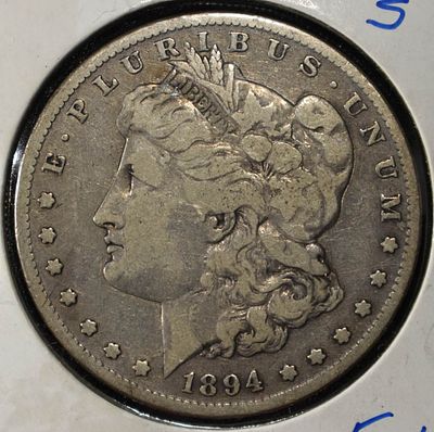 1894-S MORGAN DOLLAR. CHECK OUT OUR UPCOMING AUCTIONS ESTIMATE $90 - $130.