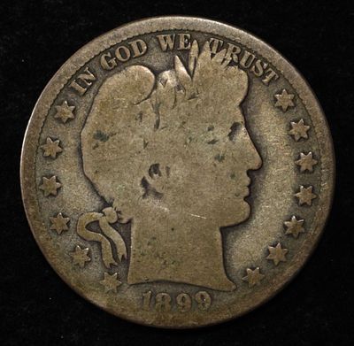 1899-O BARBER HALF DOLLAR. CHECK OUT OUR UPCOMING AUCTIONS ESTIMATE $80 - $120.