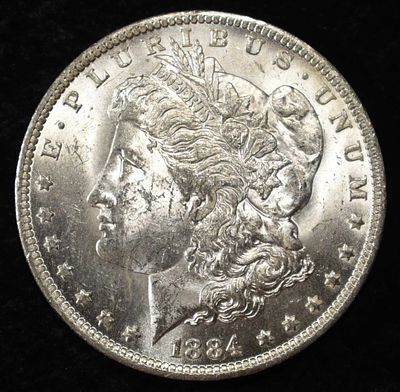 1884-O MORGAN DOLLAR BU. TOP RATED AUCTION HOUSE ESTIMATE $130 - $150.