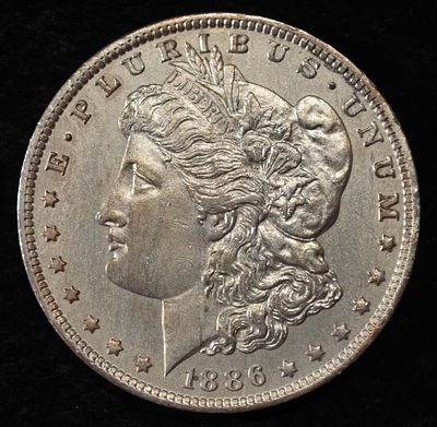 1886-O MORGAN DOLLAR SHARP UNC OLD CLEANING. CHECK OUT OUR UPCOMING AUCTIONS ESTIMATE $1300 - $1800.