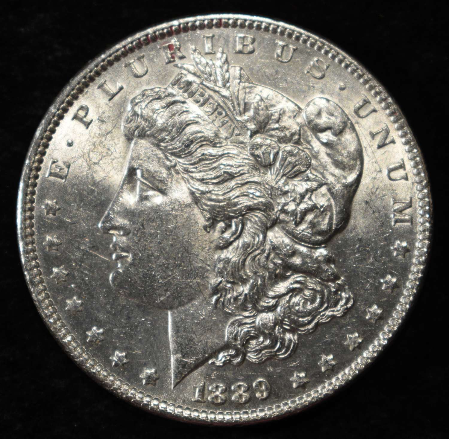 1889 MORGAN DOLLAR AU