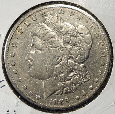 1889-CC MORGAN DOLLAR XF. CHECK OUT OUR UPCOMING AUCTIONS ESTIMATE $4700 - $5200.