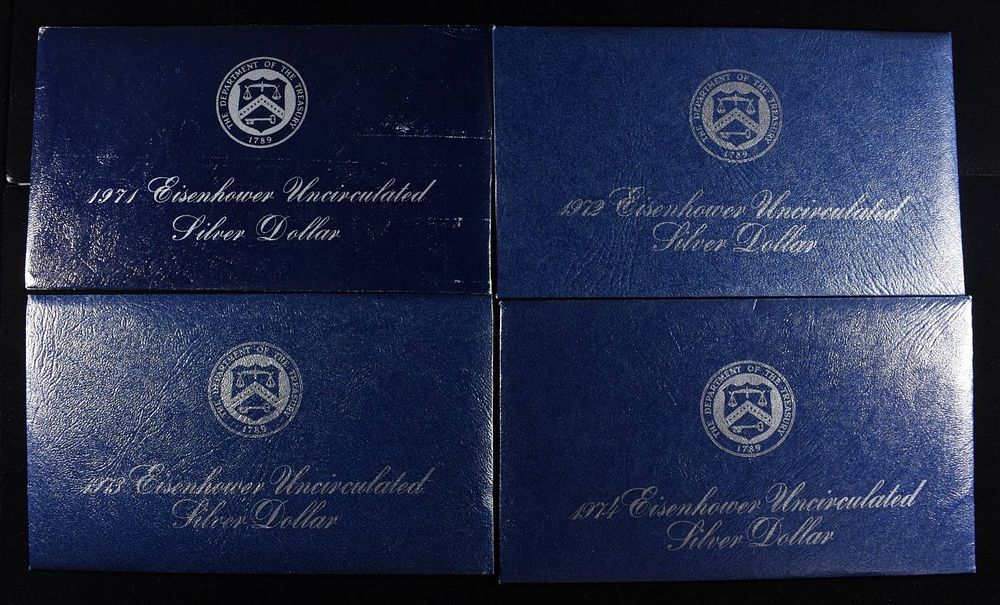 1971-1974 EISENHOWER SILVER DOLLARS BLUE PACKAGING. CHECK OUT OUR UPCOMING AUCTIONS ESTIMATE 