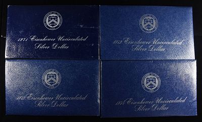 1971-1974 EISENHOWER SILVER DOLLARS BLUE PACKAGING. CHECK OUT OUR UPCOMING AUCTIONS ESTIMATE 