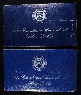 (2) 1971 EISENHOWER DOLLAR BLUE PACKAGING. WEEKLY COIN & CURRENCY AUCTIONS ESTIMATE $75 - $100.