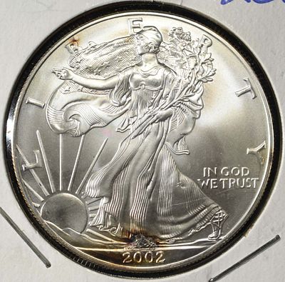 2002 AMERICAN SILVER EAGLE. WEEKLY COIN & CURRENCY AUCTIONS ESTIMATE $100 - $150.