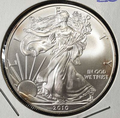 2010 AMERICAN SILVER EAGLE. CHECK OUT OUR UPCOMING AUCTIONS ESTIMATE $100 - $150.