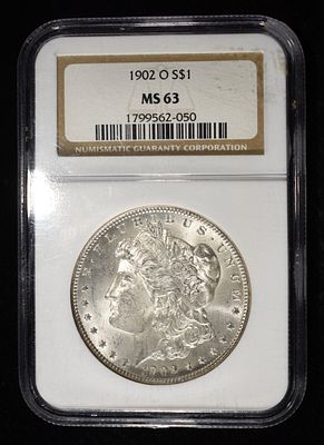 1902-O MORGAN DOLLAR NGC MS-63. CHECK OUT OUR UPCOMING AUCTIONS ESTIMATE $130 - $150.