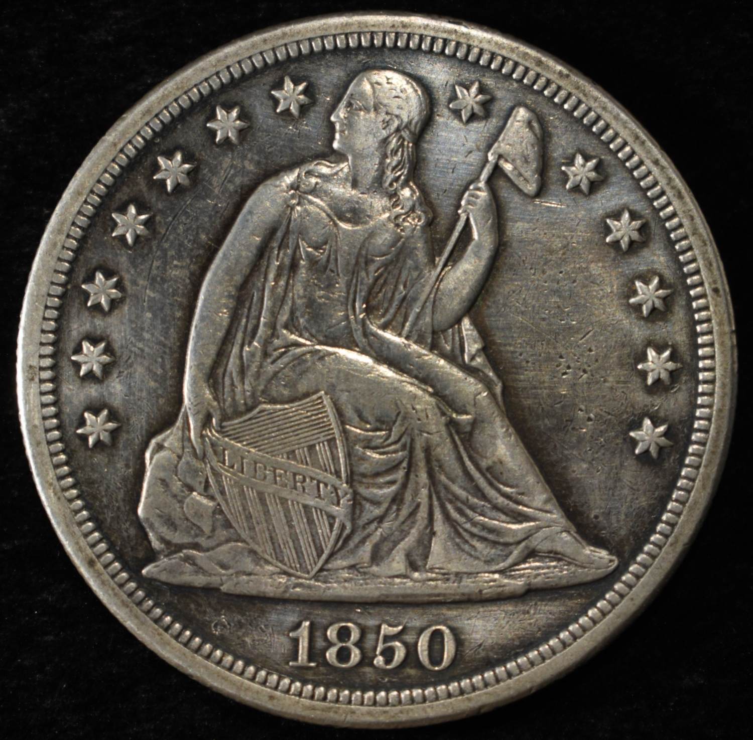 1850-O SEATED LIBERTY DOLLAR AU