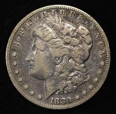 1880-S MORGAN DOLLAR. CHECK OUT OUR UPCOMING AUCTIONS ESTIMATE $90 - $130.