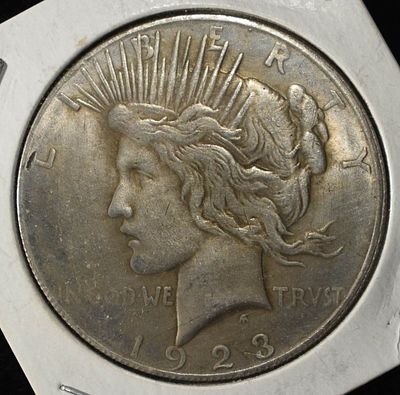 1923 PEACE DOLLAR. CHECK OUT OUR UPCOMING AUCTIONS ESTIMATE $90 - $130.