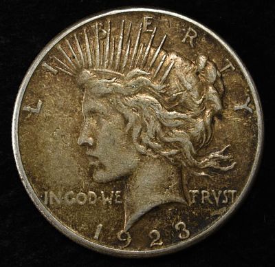 1923-S PEACE DOLLAR. CHECK OUT OUR UPCOMING AUCTIONS ESTIMATE $90 - $130.