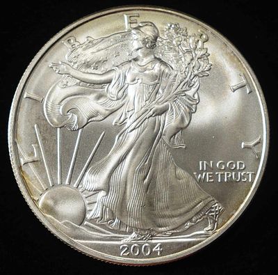 2004 AMERICAN SILVER EAGLE. CHECK OUT OUR UPCOMING AUCTIONS ESTIMATE $130 - $180.